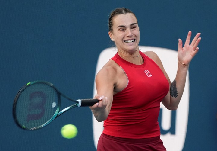 Aryna Sabalenka, of Belarus, hits a return to Viktoriya Tomova, of Bulgaria, during the Miami Open tennis tournament, Thursday, March 20, 2025, in Miami Gardens, Fla. (AP Photo/Lynne Sladky)